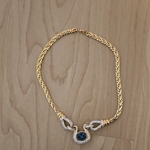 Elegant Gold and Silver Necklace with Blue Gemstone